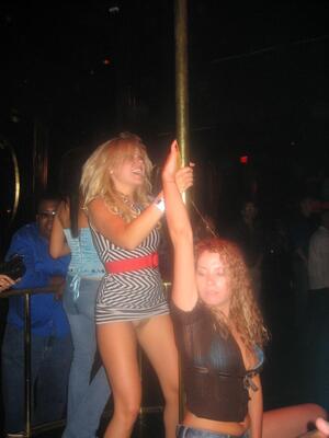 Picture tagged with: Blonde, Brunette, Legs, 2 girls, Public