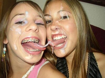 Picture tagged with: Blonde, Cumshot, 2 girls, Facial, Mouth, Tongue