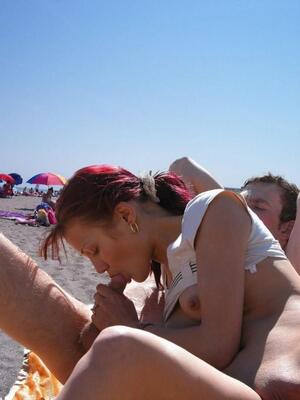 Picture tagged with: Blowjob, Redhead, Beach, Handjob, Public, Small Tits