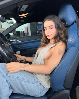 Picture tagged with: Brunette, Jameliz Benitez Smith, American, Car, Smiling, Tattoo