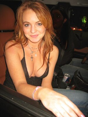 Picture tagged with: Lindsay Lohan, Redhead, Car, Celebrity - Star, Cute, Smiling
