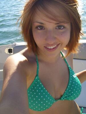 Picture tagged with: Redhead, Bikini, Boat, Eyes, Selfie, Smiling