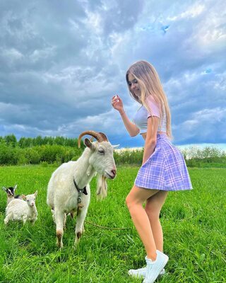 Picture tagged with: Skinny, Blonde, Lera Buns - Valeria Titova, Cute, Goat, Legs, Nature, Russian, Smiling