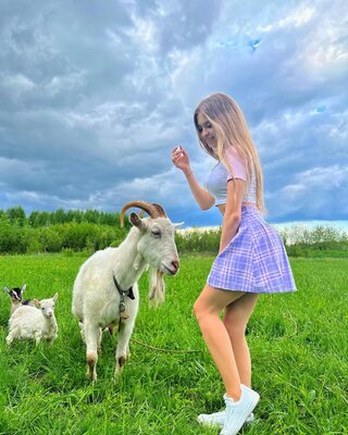 Picture tagged with: Skinny, Blonde, Lera Buns - Valeriia Makusheva - Valeria Titova, Cute, Goat, Legs, Nature, Russian, Smiling